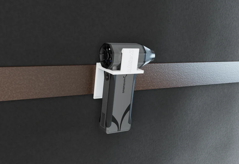 BLOWZER X6 carried on a work belt in the drill-hook holster